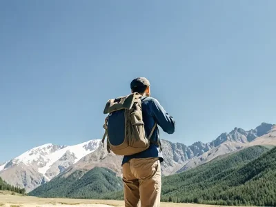 male-traveler-in-kyrgyzstan-stands-with-his-back