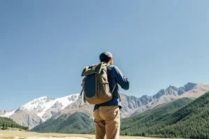 male-traveler-in-kyrgyzstan-stands-with-his-back